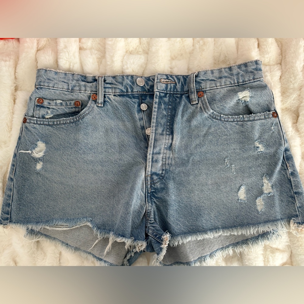 Zara denim shorts. Distressed with natural hem. Mid rise. Never worn. Tags on.